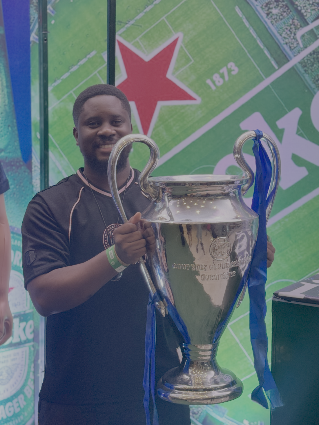 Chinedu Gbulie holding the UEFA Champions League trophy